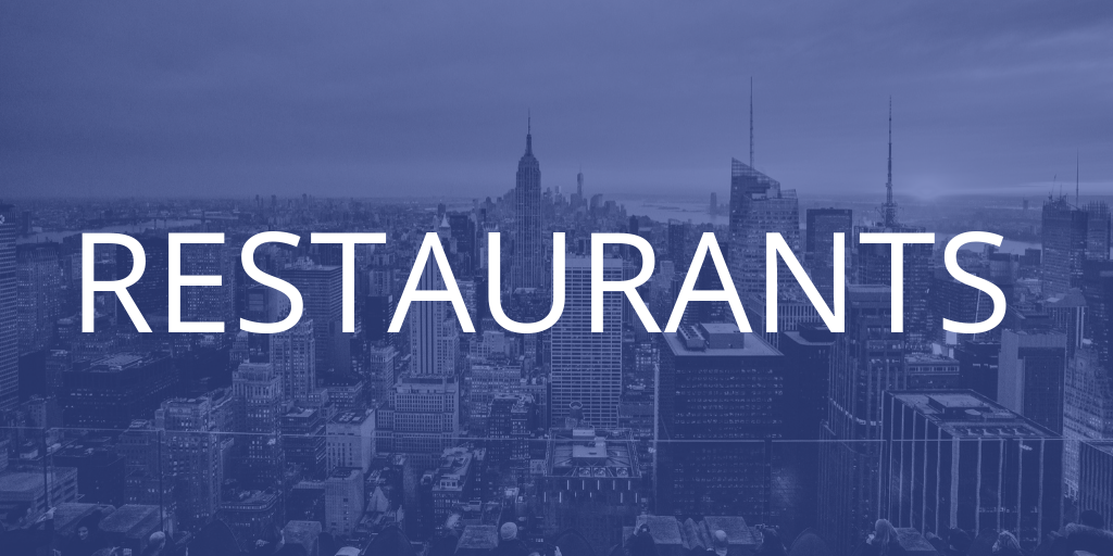 A New York skyline with a blue tint over it, the text introduces the restaurants section of the article
