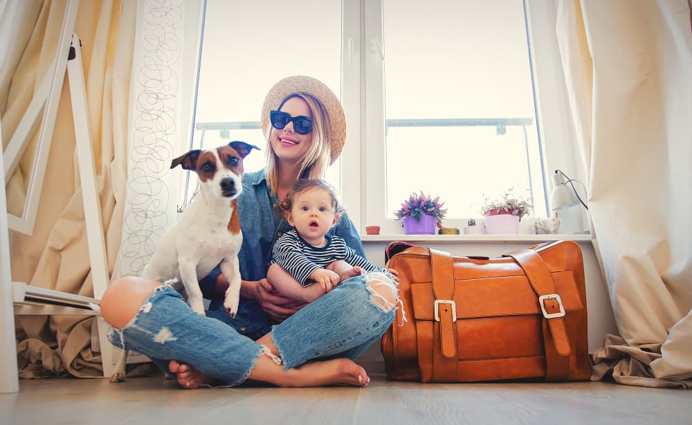Woman packing for vacation with dog